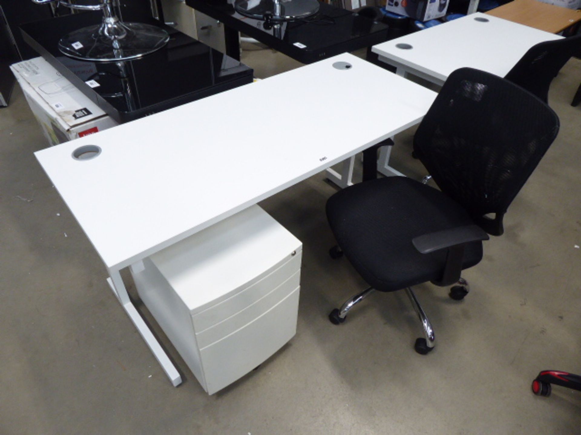 White medium size desk complete with black cloth chair and white 3 drawer pedestal