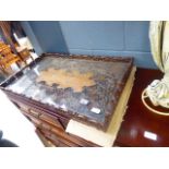 A heavily carved serving tray