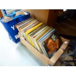 A box and bag of vinyl records