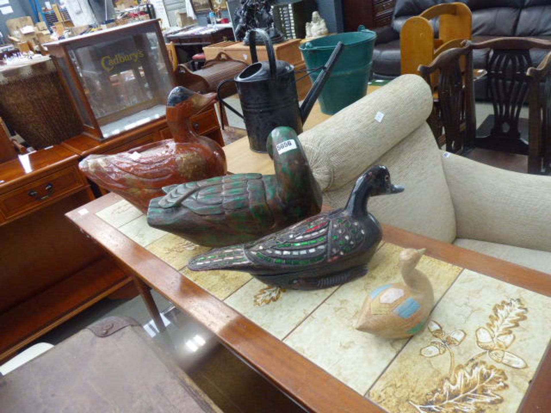 Four painted wooden ducks