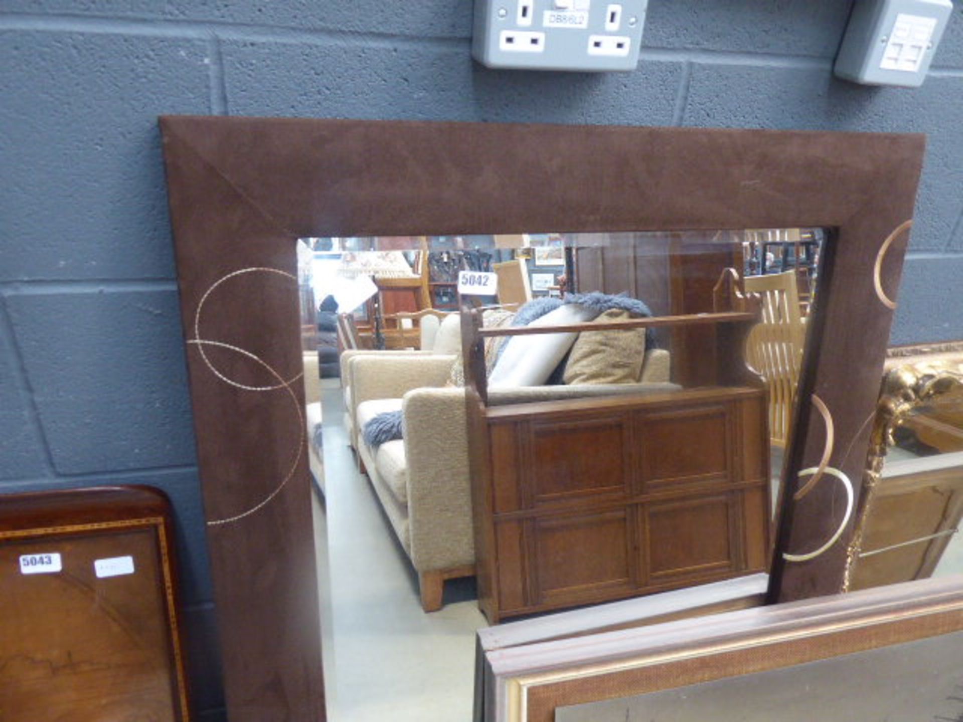 Rectangular bevelled mirror in brown suede frame