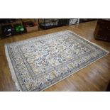 An Iranian Nain hand-made carpet, the ivory body with animals and foliage,