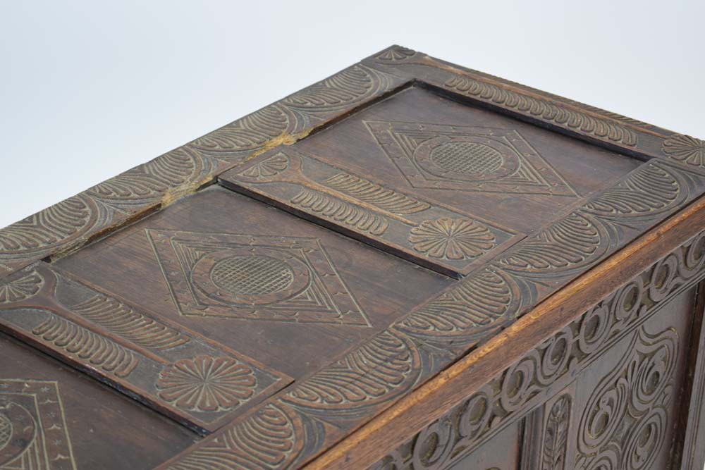 A 20th century oak and panelled coffer decorated with carved foliate carvings throughout, l. - Image 3 of 8