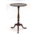 An 18th century and later mahogany wine/candle table,