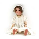An early 20th century SFJB (Societe Francaise de Fabrication de Bebes et Jouets) bisque headed doll