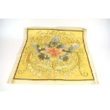 An early 20th century silk and gold thread embroidery depicting flowers in full bloom,