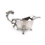 A silver sauce boat of typical form with leaf capped c-scroll handle, Deakin & Francis,