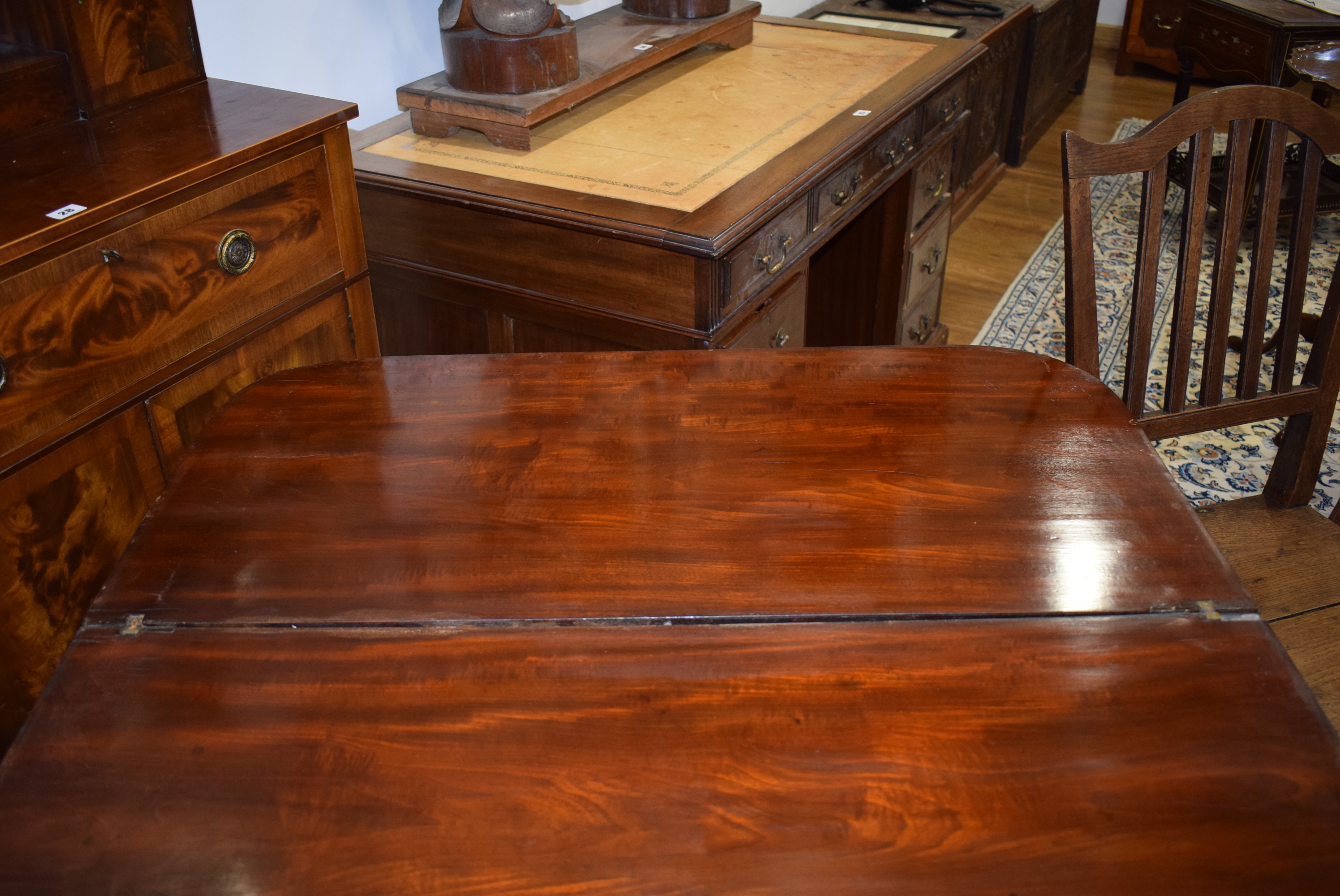 A George III mahogany tea table, the plain frieze over turned tapering legs with castors, w. - Image 8 of 18