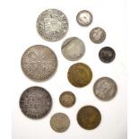 A group of coins including a reproduction George III spade guinea, an 1889 crown,
