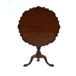An 18th century and later mahogany supper table, the tilt-top with a piecrust border,