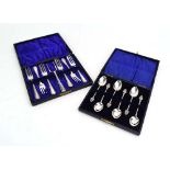 A cased set of six silver teaspoons with foliate finial's, maker AJB, Birmingham 1907,