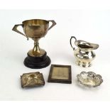 A mixed parcel of silver comprising a two handled trophy vase, an ashtray, a pin dish,