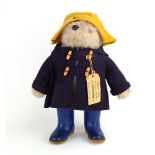 A Gabrielle Designs Paddington Bear wearing a yellow felt hat,