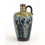 A Doulton Lambeth jug of baluster form decorated with stylised thistles on a mottled green ground,