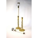 A pair of Victorian brass candlesticks with 1920/30's 'Arctic Candle Lamp' inserts, h.