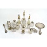 Sixteen early 20th century silver mounted dressing table bottles and accessories including a pot