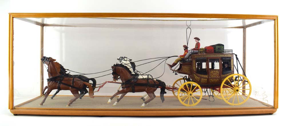 A plastic kit built Wells Fargo overland stagecoach, cased, case w. 92.