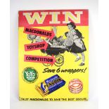 A cardboard sign advertising the Macdonalds Toyshop competition, 66 x 50.