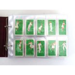 Two album of Godfrey Phillips, Wills, Ogdens and Players cigarette cards including Animalloys (48),