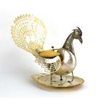 A mother-of-pearl and metalwares mounted spoon warmer in the form of a peacock, h.