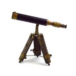 A late 20th century brass telescope with a faux leather cover on an adjustable stand