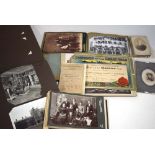 A group of approximately one hundred photographs and postcards, contained in two albums,