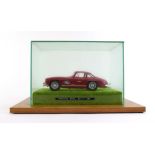 A Burago 1/18 scale 1954 Mercedes Benz 300SL, cased, case w.