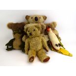 A mixed group of stuffed toys including a Merrythought frog, a Merrythought parrot,