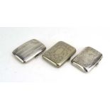 Two early 20th century silver cigarette cases of cushioned rectangular form,