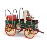 A painted wooden model of a grocers wagon, w.