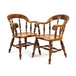A pair of Stewart Linford elm and yew 'Bergere Bow Chairs' together with the associated sales