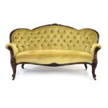 A 19th century rosewood and button upholstered serpentine sofa on acanthus capped front legs with