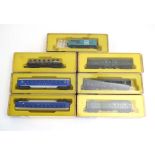 Seven items of Arnold Rapido N gauge rolling stock and coaches,