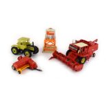 A group of Britains, Corgi and other farmyard vehicles including a combine harvester, tractors,