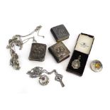 Three silver mounted common prayer books, two Scottish silver brooches, a silver medallion,