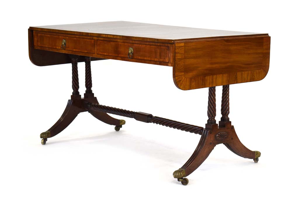 A Regency mahogany and tulipwood crossbanded sofa table inlaid with boxwood and ebonised lines,