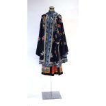 An early 20th century Chinese silk embroidered robe together with a similar skirt