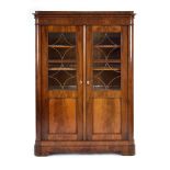 A 19th century Danish mahogany two-door glazed display cabinet on block feet, w.