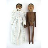 A pair of late 19th/early 20th century painted wooden peg type dolls, l.