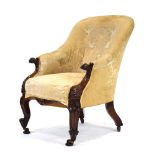 An early Victorian rosewood and button upholstered fireside armchair with scrolled arms and feet,