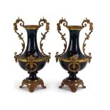 A pair of green lustre vases mounted with gilt metal swags and mask handles, on matching feet, h.