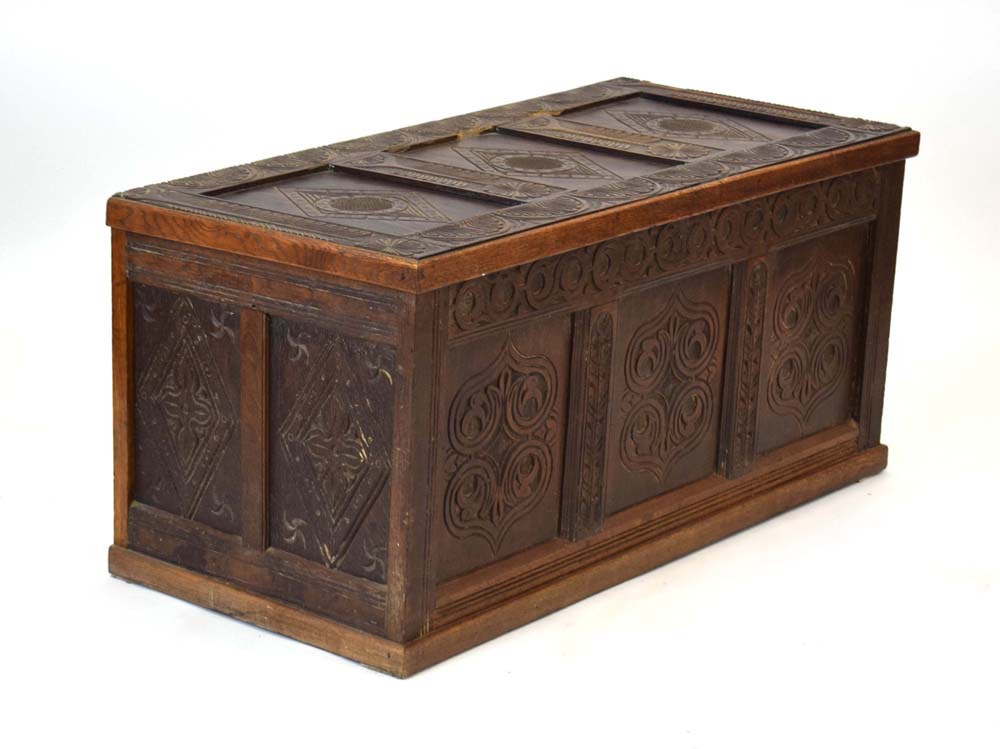 A 20th century oak and panelled coffer decorated with carved foliate carvings throughout, l. - Image 2 of 8