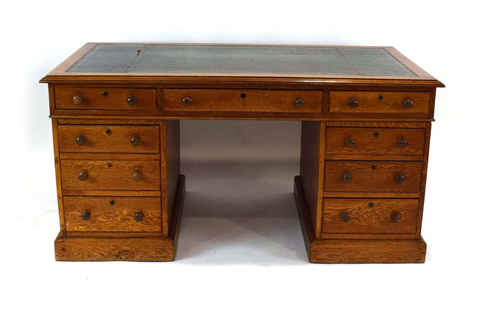 A Victorian oak twin-pedestal desk,