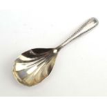 An Irish silver caddy spoon with shell shaped bowl, Royal Irish Silver Co., Dublin 1973, l. 9.
