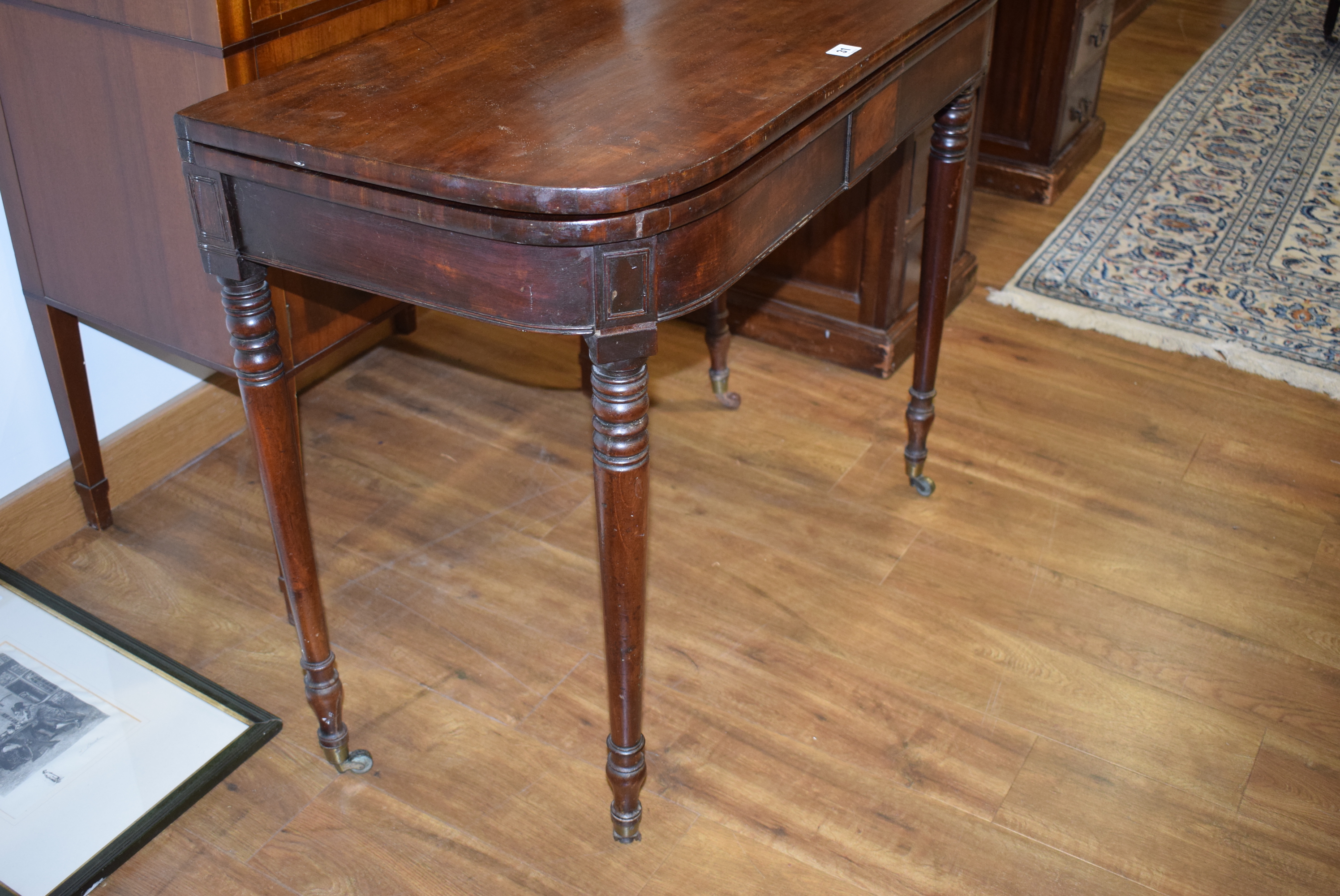 A George III mahogany tea table, the plain frieze over turned tapering legs with castors, w. - Image 18 of 18