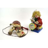 A Mobo tinplate 'Scottie' dog and a later drummer toy (2)