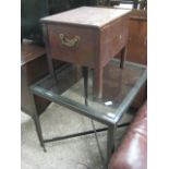 Small glass top metal table with commode