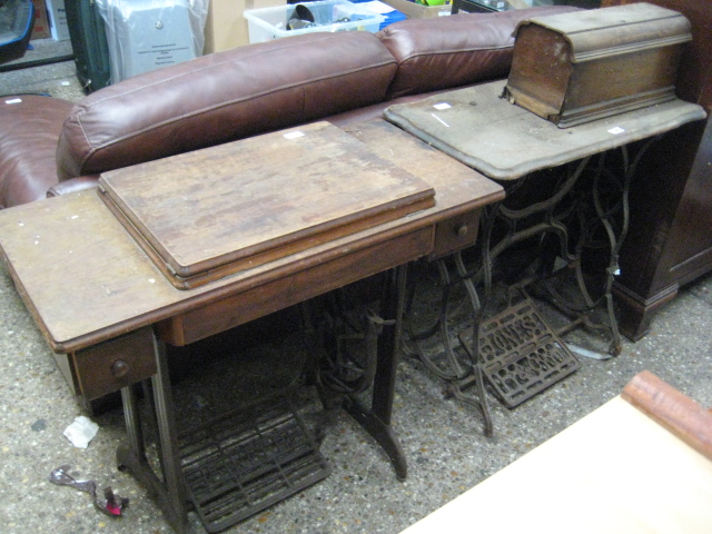 Singer sewing machine on cast iron treadle base with similar Jones & Co. sewing machine