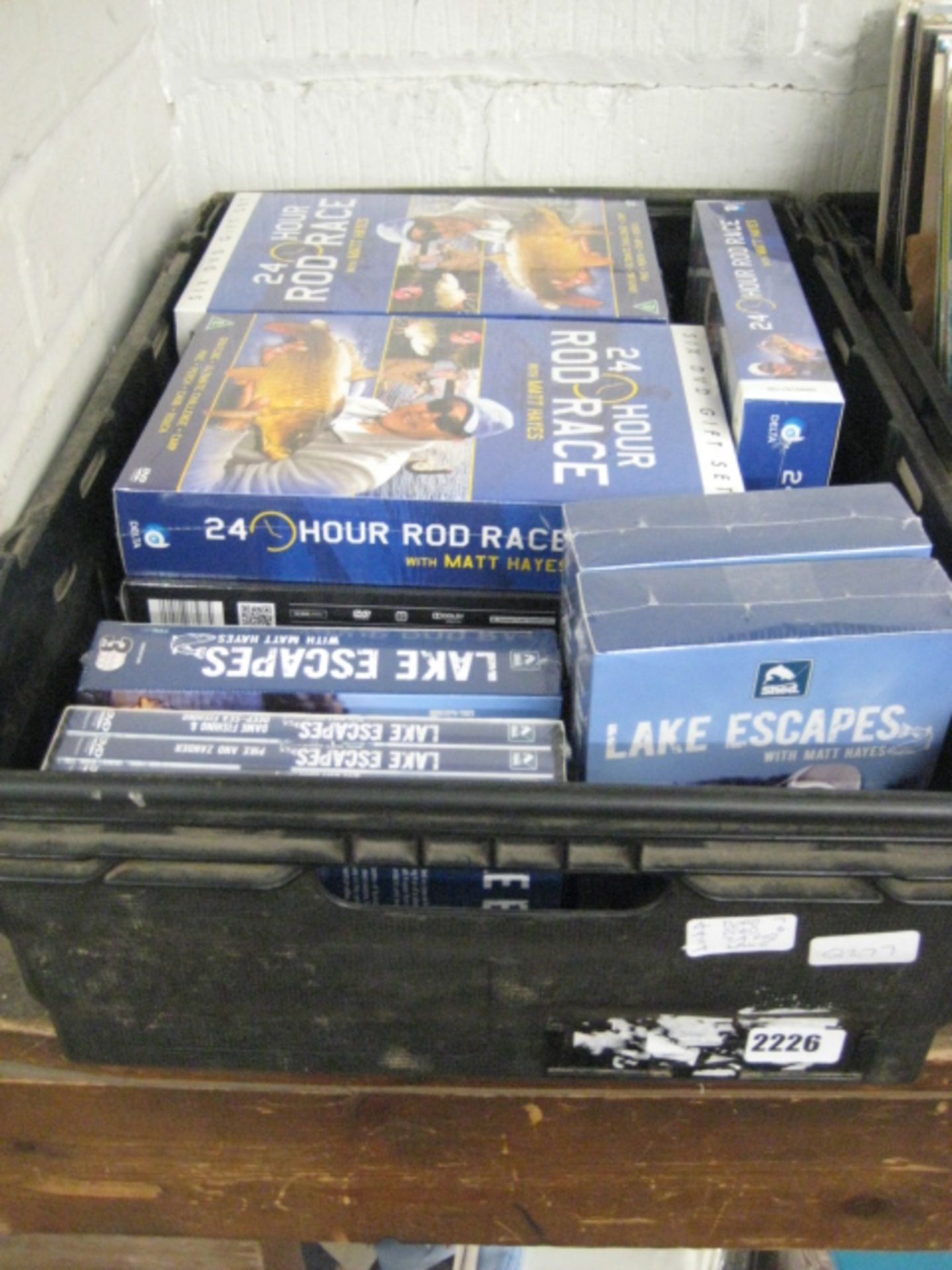 Crate of fishing themed DVDs
