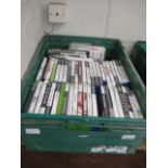 Crate of Xbox 360 and PS2 games